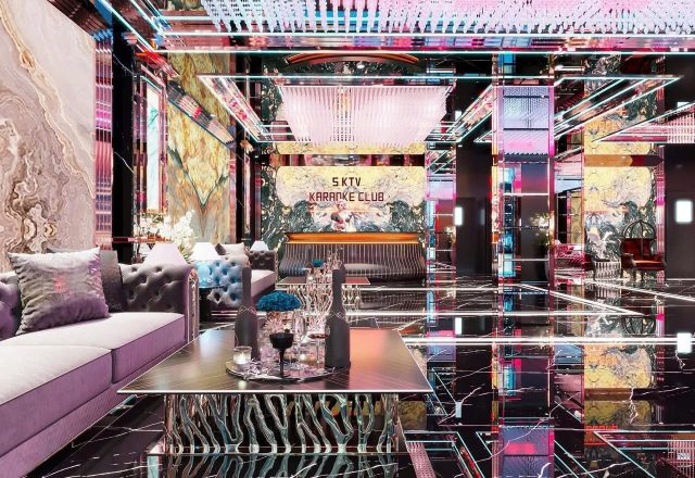 Sảnh Karaoke S KTV Club với biển tên phát sáng, sofa nhung, bàn thấp và tường ốp gương